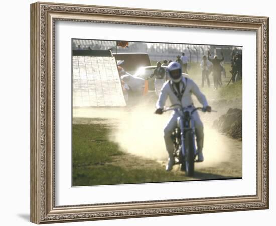 Daredevil Motorcyclist Evel Knievel Raising Dust after Completing Stunt-null-Framed Photographic Print