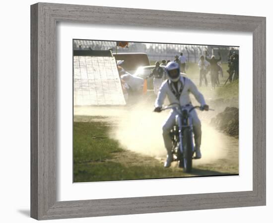 Daredevil Motorcyclist Evel Knievel Raising Dust after Completing Stunt-null-Framed Photographic Print