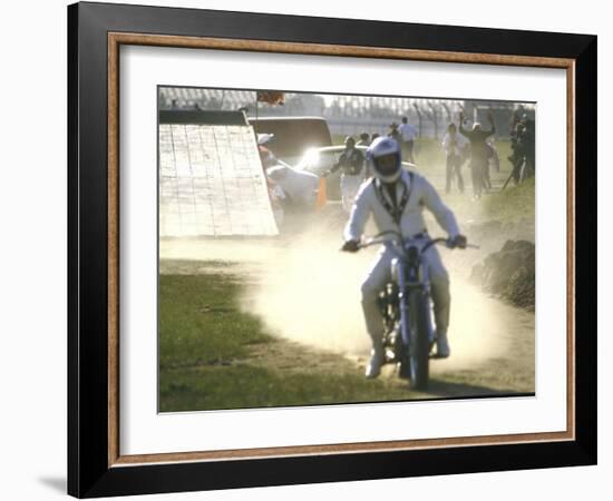 Daredevil Motorcyclist Evel Knievel Raising Dust after Completing Stunt-null-Framed Photographic Print