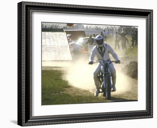 Daredevil Motorcyclist Evel Knievel Raising Dust after Completing Stunt-null-Framed Photographic Print