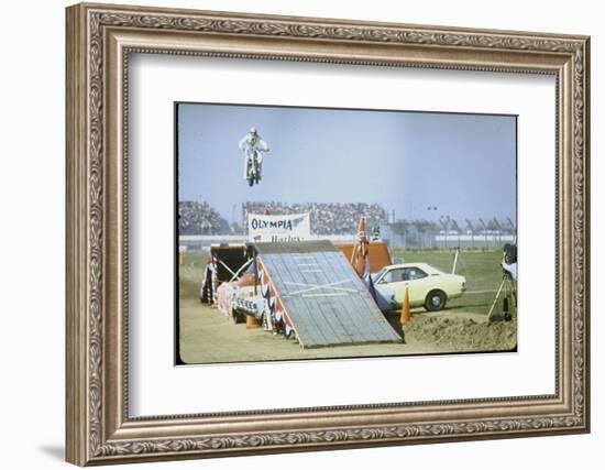 Daredevil Motorcyclist Evel Knievel Rising Very High Off Platform During Performance of a Stunt-Bill Eppridge-Framed Photographic Print