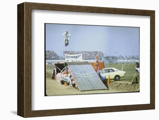 Daredevil Motorcyclist Evel Knievel Rising Very High Off Platform During Performance of a Stunt-Bill Eppridge-Framed Photographic Print