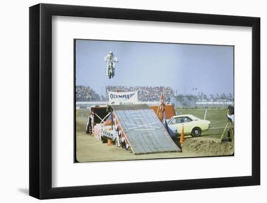 Daredevil Motorcyclist Evel Knievel Rising Very High Off Platform During Performance of a Stunt-Bill Eppridge-Framed Photographic Print
