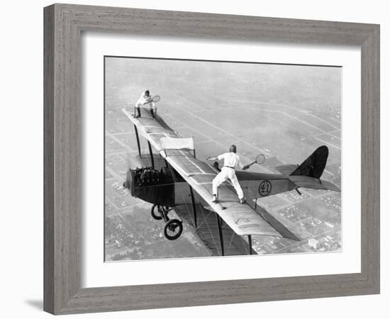 Daredevils Playing Tennis on a Biplane-null-Framed Photographic Print