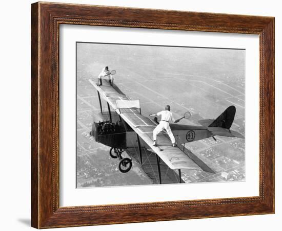 Daredevils Playing Tennis on a Biplane-null-Framed Photographic Print