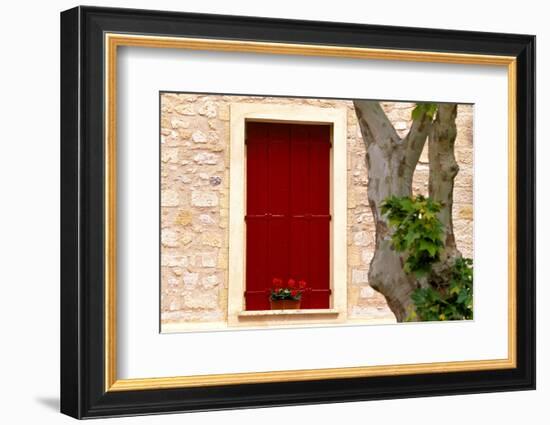 Dark red shutters in the wall of a house in France.-Tom Haseltine-Framed Photographic Print