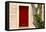 Dark red shutters in the wall of a house in France.-Tom Haseltine-Framed Premier Image Canvas