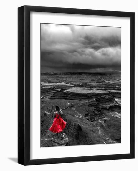 Dark storm clouds over Dead Horse Point State Park with girl in red dress standing near the cliff-David Chang-Framed Photographic Print