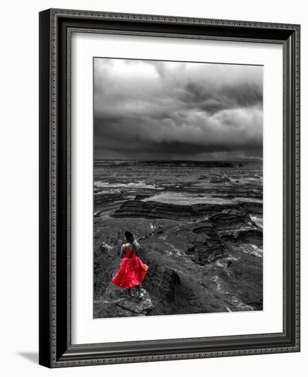 Dark storm clouds over Dead Horse Point State Park with girl in red dress standing near the cliff-David Chang-Framed Photographic Print