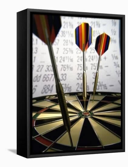 Darts on a Dartboard with Stock Figures in the Background-null-Framed Premier Image Canvas