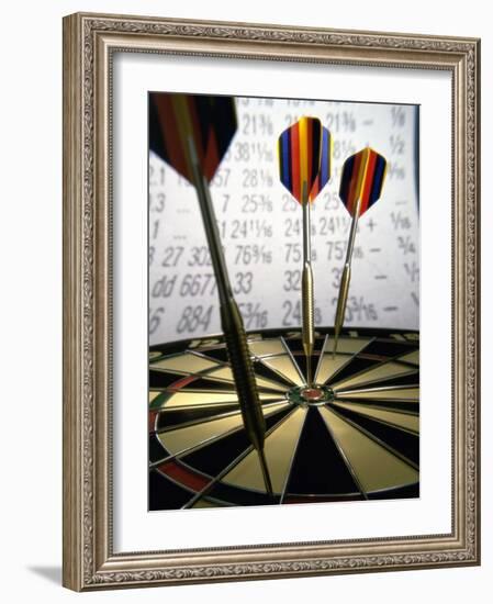 Darts on a Dartboard with Stock Figures in the Background-null-Framed Photographic Print