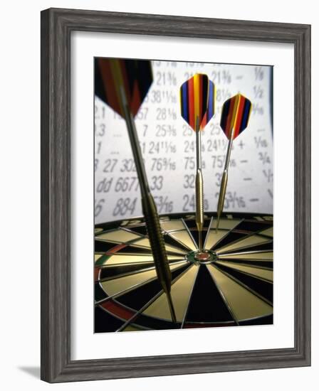 Darts on a Dartboard with Stock Figures in the Background-null-Framed Photographic Print