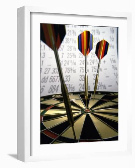 Darts on a Dartboard with Stock Figures in the Background-null-Framed Photographic Print