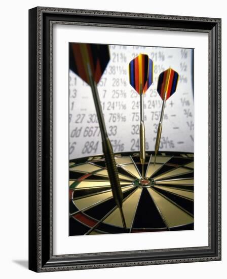 Darts on a Dartboard with Stock Figures in the Background-null-Framed Photographic Print