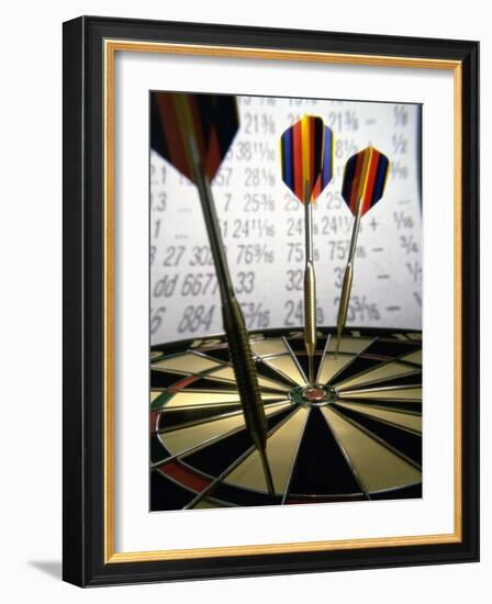 Darts on a Dartboard with Stock Figures in the Background-null-Framed Photographic Print