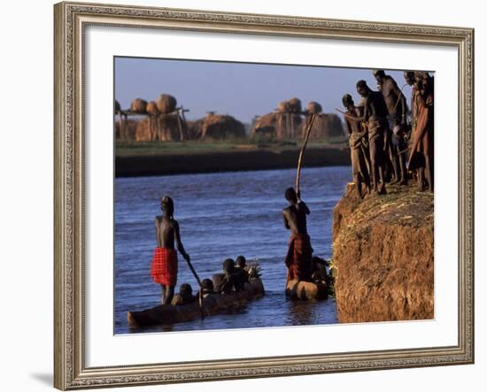 Dassanech Tribesmen and Women Load into a Dugout Canoe Ready to Pole across the Omo River, Ethiopia-John Warburton-lee-Framed Photographic Print