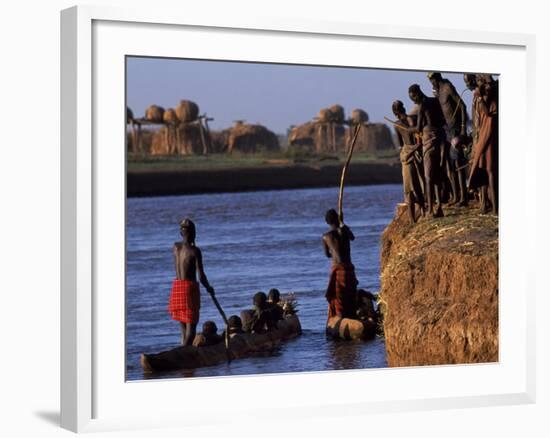 Dassanech Tribesmen and Women Load into a Dugout Canoe Ready to Pole across the Omo River, Ethiopia-John Warburton-lee-Framed Photographic Print