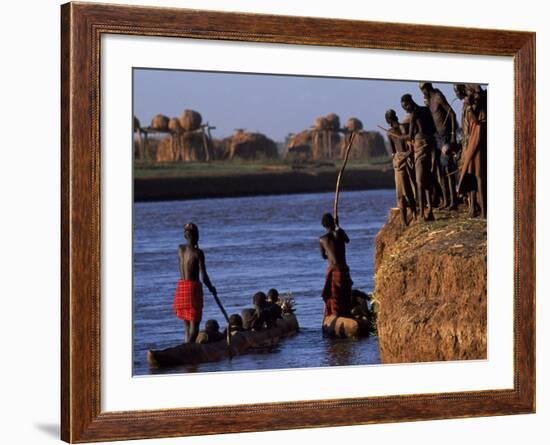 Dassanech Tribesmen and Women Load into a Dugout Canoe Ready to Pole across the Omo River, Ethiopia-John Warburton-lee-Framed Photographic Print