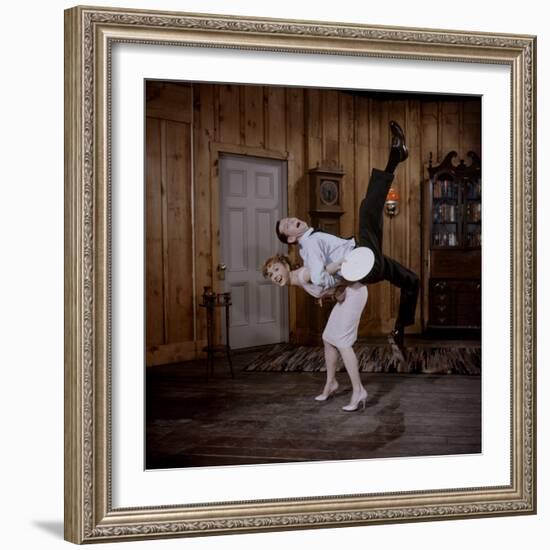 Debbie Reynolds Lifts Fellow Actor Tony Randall in a Scene from 'The Mating Game', 1959-Allan Grant-Framed Photographic Print