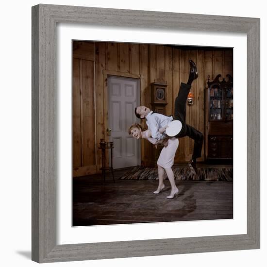 Debbie Reynolds Lifts Fellow Actor Tony Randall in a Scene from 'The Mating Game', 1959-Allan Grant-Framed Photographic Print