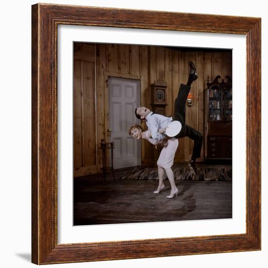 Debbie Reynolds Lifts Fellow Actor Tony Randall in a Scene from 'The Mating Game', 1959-Allan Grant-Framed Photographic Print