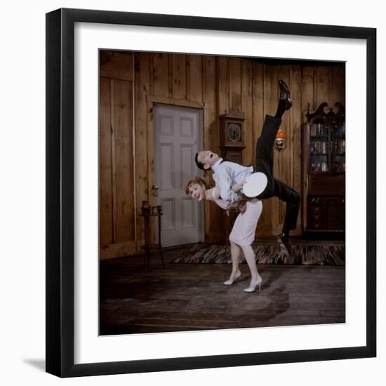 Debbie Reynolds Lifts Fellow Actor Tony Randall in a Scene from 'The Mating Game', 1959-Allan Grant-Framed Photographic Print