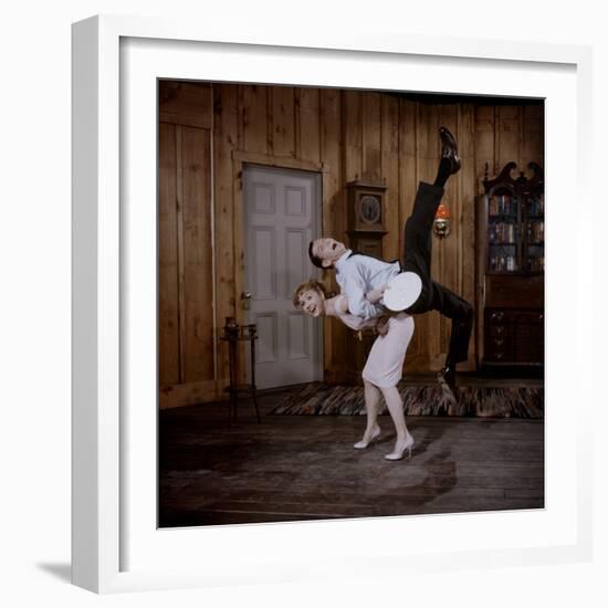 Debbie Reynolds Lifts Fellow Actor Tony Randall in a Scene from 'The Mating Game', 1959-Allan Grant-Framed Photographic Print