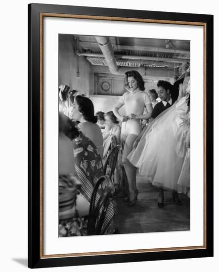 Debutante Actress Tina L. Meyer Changing Clothes Backstage in Dressing Room-Nina Leen-Framed Premium Photographic Print