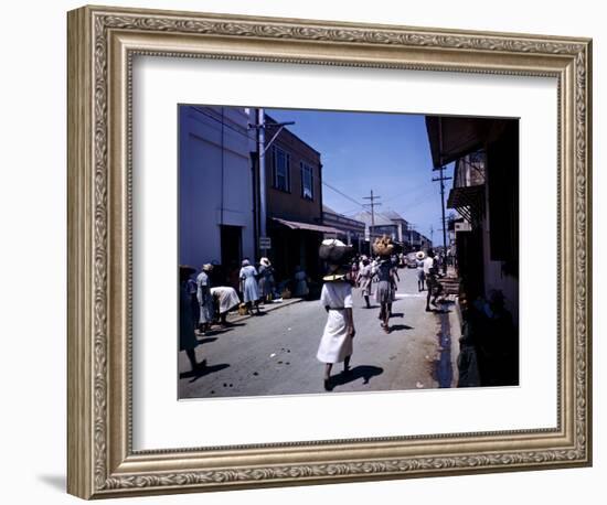 December 1946: Passersby at Market Street in Montego Bay, Jamaica-Eliot Elisofon-Framed Photographic Print