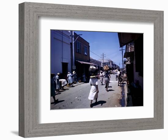 December 1946: Passersby at Market Street in Montego Bay, Jamaica-Eliot Elisofon-Framed Photographic Print