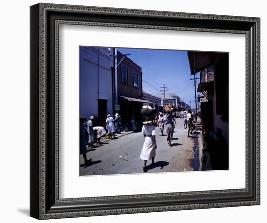 December 1946: Passersby at Market Street in Montego Bay, Jamaica-Eliot Elisofon-Framed Photographic Print