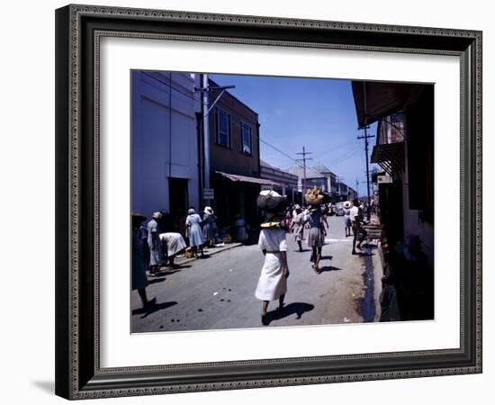 December 1946: Passersby at Market Street in Montego Bay, Jamaica-Eliot Elisofon-Framed Photographic Print