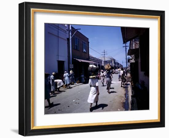 December 1946: Passersby at Market Street in Montego Bay, Jamaica-Eliot Elisofon-Framed Photographic Print