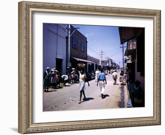 December 1946: Passersby at Market Street in Montego Bay, Jamaica-Eliot Elisofon-Framed Photographic Print