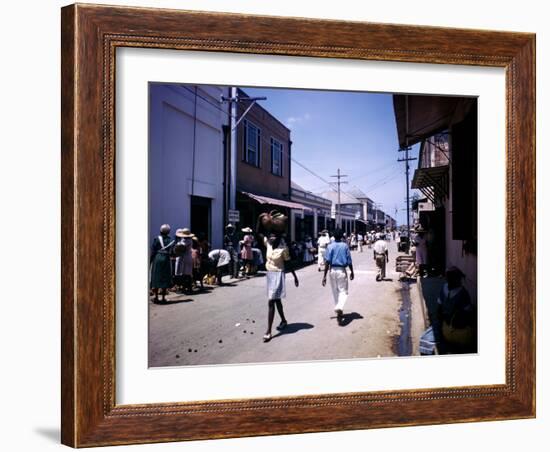 December 1946: Passersby at Market Street in Montego Bay, Jamaica-Eliot Elisofon-Framed Photographic Print