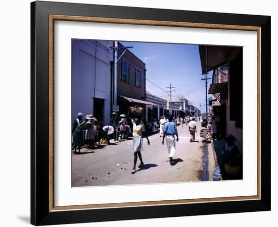 December 1946: Passersby at Market Street in Montego Bay, Jamaica-Eliot Elisofon-Framed Photographic Print