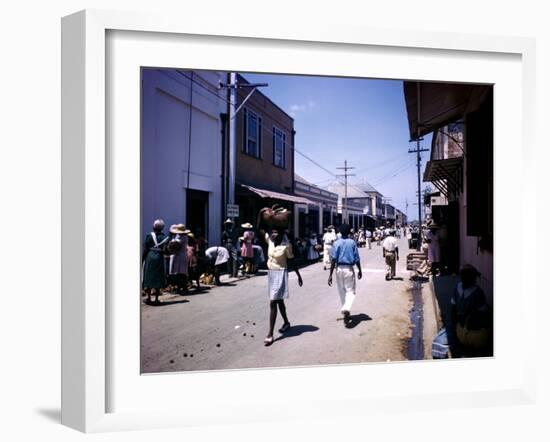 December 1946: Passersby at Market Street in Montego Bay, Jamaica-Eliot Elisofon-Framed Photographic Print