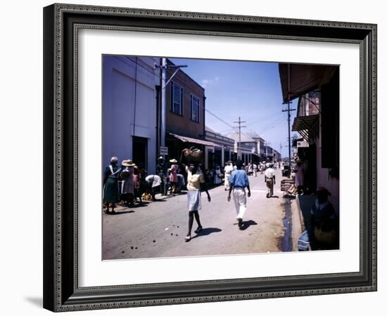 December 1946: Passersby at Market Street in Montego Bay, Jamaica-Eliot Elisofon-Framed Photographic Print