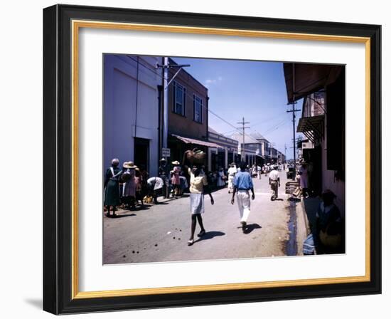 December 1946: Passersby at Market Street in Montego Bay, Jamaica-Eliot Elisofon-Framed Photographic Print