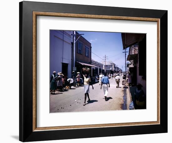 December 1946: Passersby at Market Street in Montego Bay, Jamaica-Eliot Elisofon-Framed Photographic Print