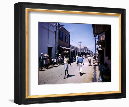 December 1946: Passersby at Market Street in Montego Bay, Jamaica-Eliot Elisofon-Framed Photographic Print