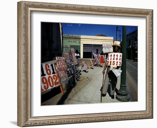 December 1946: War Veteran Sells Lottery Tickets for the Government Lottery in Camaguey, Jamaica-Eliot Elisofon-Framed Photographic Print