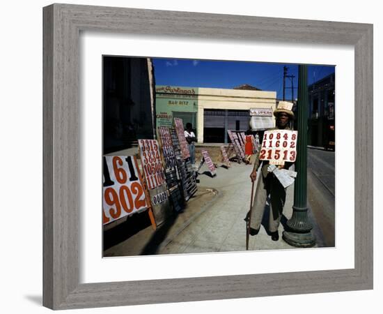 December 1946: War Veteran Sells Lottery Tickets for the Government Lottery in Camaguey, Jamaica-Eliot Elisofon-Framed Photographic Print