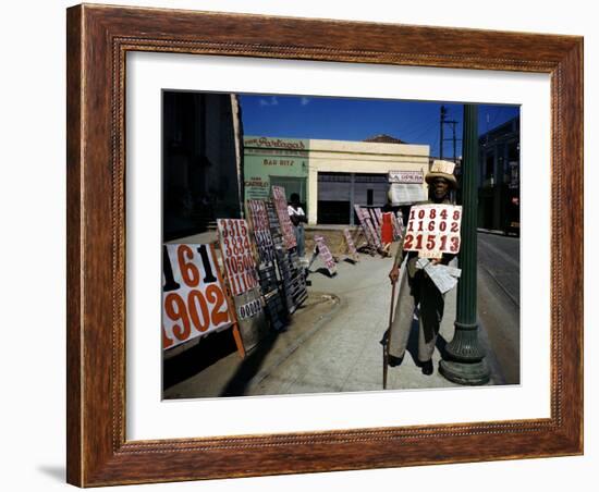 December 1946: War Veteran Sells Lottery Tickets for the Government Lottery in Camaguey, Jamaica-Eliot Elisofon-Framed Photographic Print