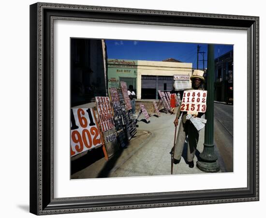 December 1946: War Veteran Sells Lottery Tickets for the Government Lottery in Camaguey, Jamaica-Eliot Elisofon-Framed Photographic Print