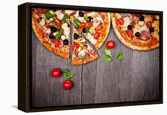 Delicious Italian Pizzas Served on Wooden Table-Jag_cz-Framed Premier Image Canvas