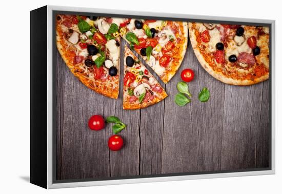 Delicious Italian Pizzas Served on Wooden Table-Jag_cz-Framed Premier Image Canvas