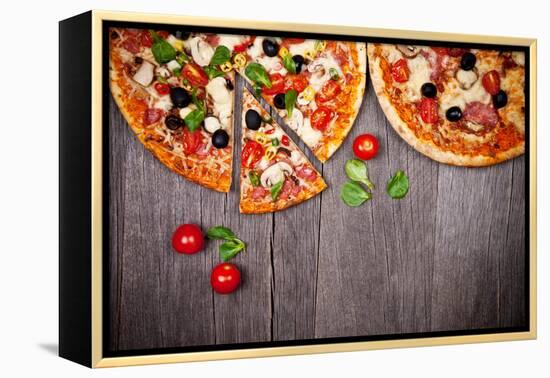 Delicious Italian Pizzas Served on Wooden Table-Jag_cz-Framed Premier Image Canvas