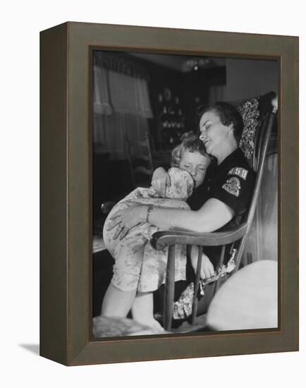 Den Mother Still in Uniform, Sleeping While Holding Her Daughter-null-Framed Premier Image Canvas