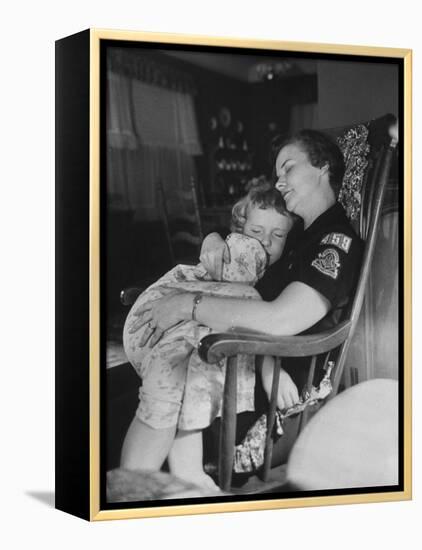 Den Mother Still in Uniform, Sleeping While Holding Her Daughter-null-Framed Premier Image Canvas